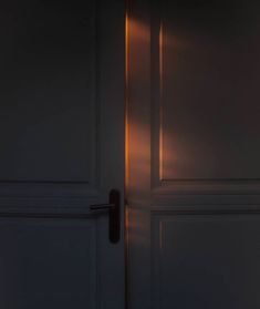 an open door with a light shining on it