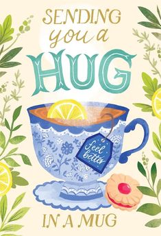 a blue cup with lemons and leaves around it, says sending you a hug in a mug