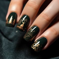 a woman's hand with green and gold christmas nail art designs on her nails