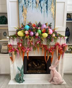 a fireplace decorated with easter decorations and bunnies