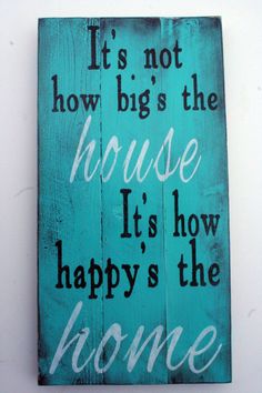 a wooden sign that says it's not how big the house is, it's how happy the home
