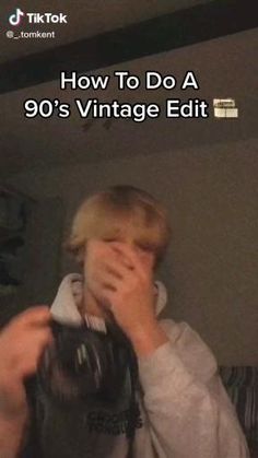 a young man is covering his face while taking a selfie with the text how to do a 90's vintage edit