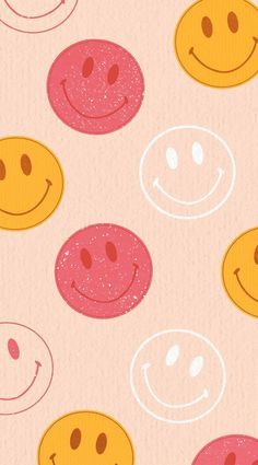 an image of some smiley faces on a pink background