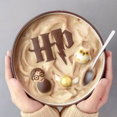 a person holding a bowl with food in it and the word h on top of it