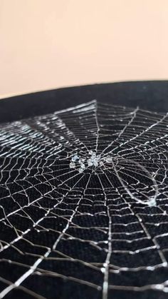 a spider web is shown on top of a table