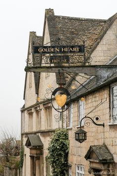 an old building with a sign that says golden heart
