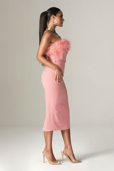 Romance and elegance are the basis of our new season collection and 'Carmen' works it so well. The blush pink hue sets the tone as it oozes elegant glamour. Cut from our lustrous heavy crepe in a flattering midi length, 'Carmen' has a close fitting silhouette that hugs every curve. The curved neckline and gorgeous feathers trim frame the décolletage so beautifully and the ultra chic bodice has a pointed hem that features our incredible corsetry boning to cinch the waist.The skirt is relaxed belo Dresses, Formal Dresses, Dresses Formal Elegant, Strapless Corset, Dress To Impress, Evening Gowns Elegant, Elegant Dress, Robe, Strapless