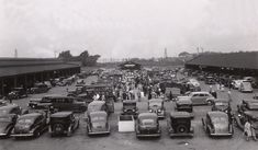 an old photo of cars parked in a parking lot