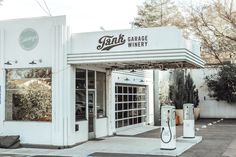 an old gas station with the sign bank garage winery on it's front door