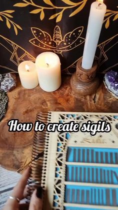 a person is writing on a book with candles in front of it and the words how to create signs
