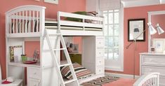 a white bunk bed sitting next to a pink wall