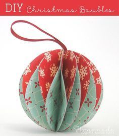 an origami christmas bauble with red and green decorations