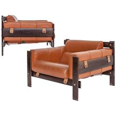 two brown leather chairs sitting next to each other