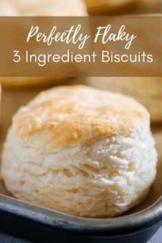 three ingredient biscuits in a baking pan with text overlay that reads perfectly flaky 3 ingredient biscuits