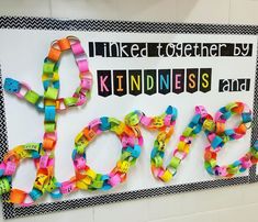 a bulletin board with the word love spelled out in different colors and letters on it