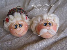 two old fashioned santa claus ornaments on a white cloth covered bed with the caption relaxes & smiles by karni