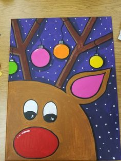 a painting of a reindeer with christmas ornaments on it's antlers and nose