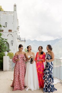 Sharon's closest friends wore colorful floral floor-length dresses - many featuring unique details including ruffles, off-the-shoulder puff sleeves, fun cut-outs.