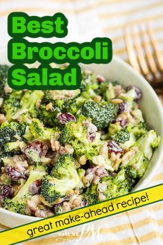 broccoli salad with cranberries and nuts in a white bowl on a table