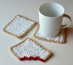three crocheted coasters and a coffee cup on a table