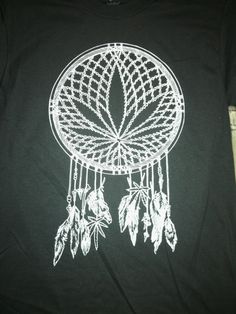 a t - shirt with a drawing of a dream catcher on it's chest