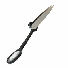 a large knife with a black handle on it's end and a magnifying glass
