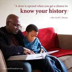 a man sitting on a couch with a young boy who is writing in a book