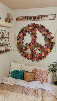 a bedroom with a wreath on the wall