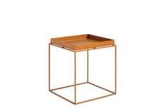 the side table is made out of metal and has a brown leather tray on top