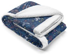 a blue blanket with stars and planets on it, folded up to show the bottom