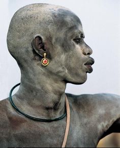 Africa | Portrait of a young Dinka man.  South Sudan.  They cover their bodies with ash both for protection and beautifying purposes |  Just one of the many fantastic photographs included in the publication 'Painted Bodies: African Body Painting, Tattoos and Scarification' by Carol Beckwith and Angela Fisher ~ Release date Sept 18th 2012. { www.amazon.com/... } Body Art, Bodypainting, Tribal People, Arc