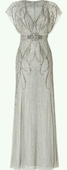 a women's silver dress with sequins on the shoulders and neckline