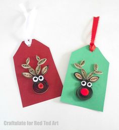 two tags with reindeer faces on them hanging from red and green string attached to each other
