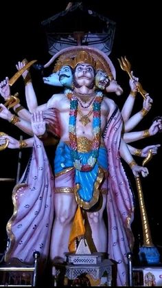 a statue of the hindu god with his arms outstretched