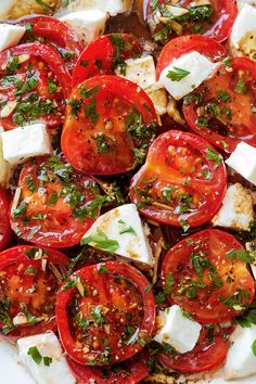 tomatoes, mozzarella and parsley on a plate