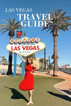 a woman in a red dress is standing under the welcome sign to las vegas, nevada