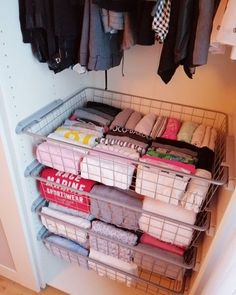 the closet is full of clothes and other items for storage, including t - shirts