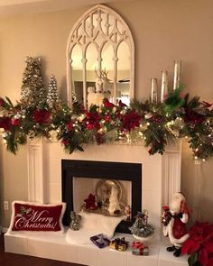 a fireplace decorated for christmas with stockings and decorations
