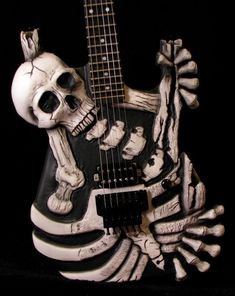 a skeleton playing a guitar with its mouth open and hands in the shape of a skull