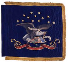 an embroidered flag with eagle and stars on it