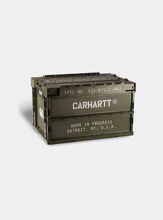 an empty crate sitting on top of a white surface with the words carhart printed on it