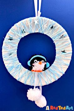 a paper plate wreath with a penguin on it