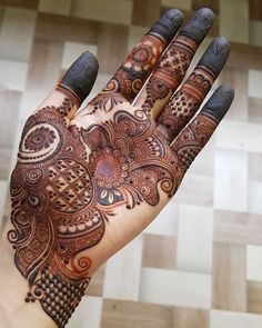 a hand that has some henna on it