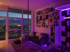 a living room filled with furniture and purple lighting