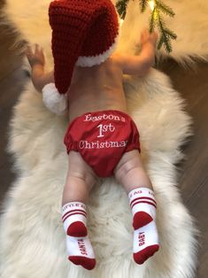 a baby is wearing a santa hat and diaper