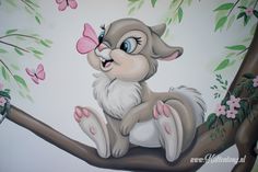 a painting of a monkey sitting on a tree branch with pink butterflies in its mouth