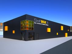 a black building with yellow windows and the words seatbox on it's side