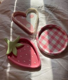 three different shaped trays sitting on top of a table