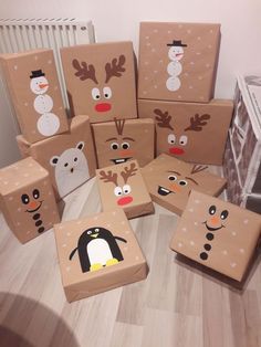 cardboard boxes decorated with christmas characters and snowmen