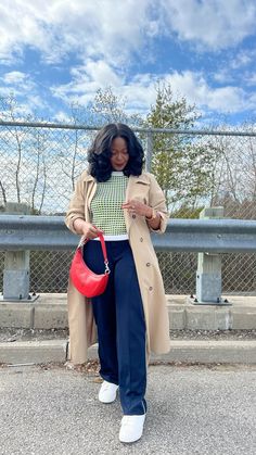 Styling Adidas pants with a trench coat can create a fashionable and sporty-chic look.     How to style a red bag   Adidas pants outfit   Trench coat outfit   Spring outfit ideas Trousers, Chic